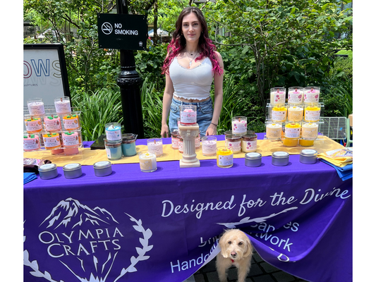 Handmade eco-conscious luxury candles by a woman owned business pop up shop at the Hudson Yards in New York City. Featuring my cute dog alongside my flower candles.